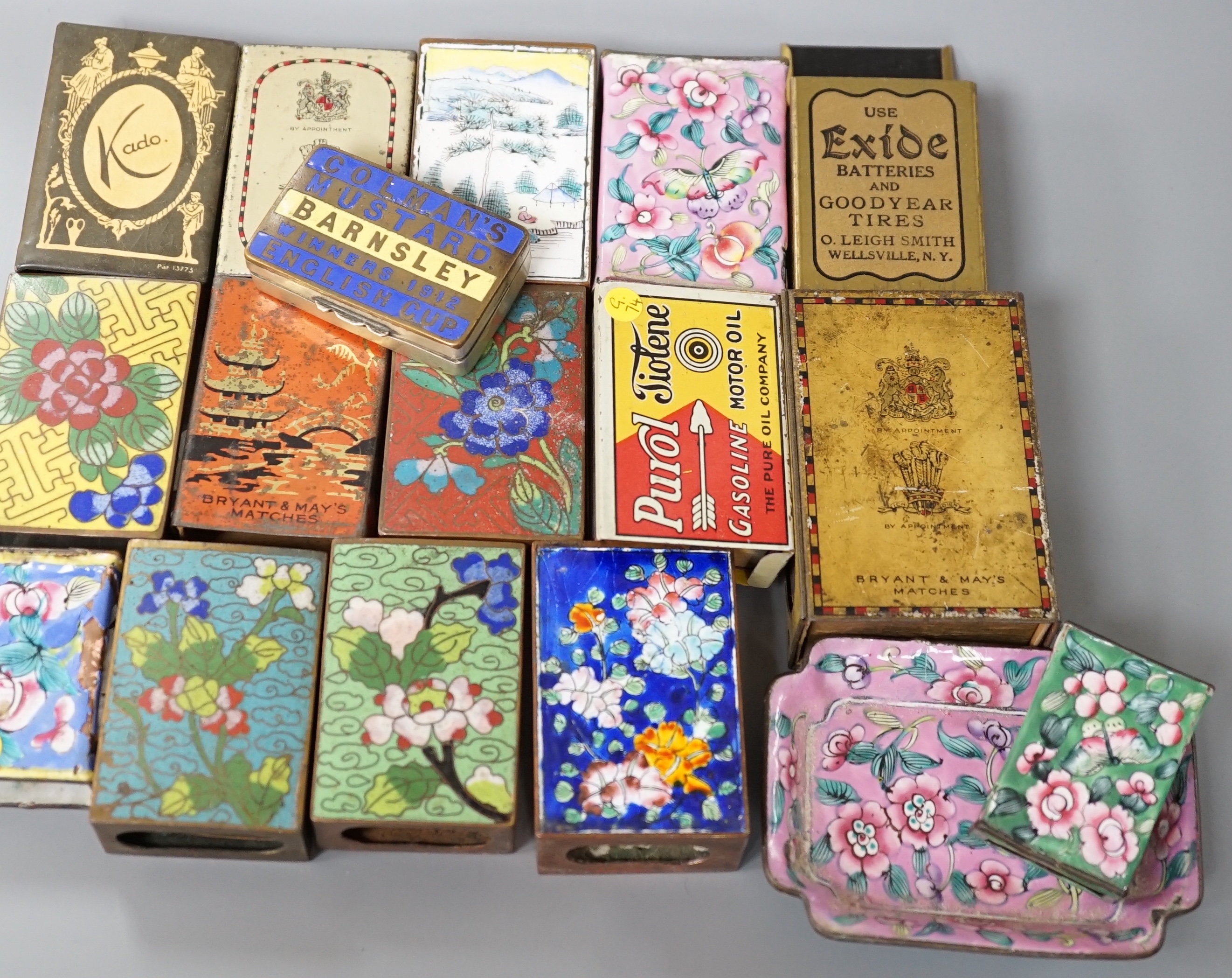 A collection of advertising and other enamelled metal match box holders